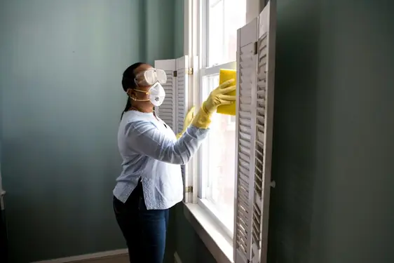 IICRC certified MoldVanta Solutions technician inspecting water damage moisture levels in a Gilbert AZ residential property